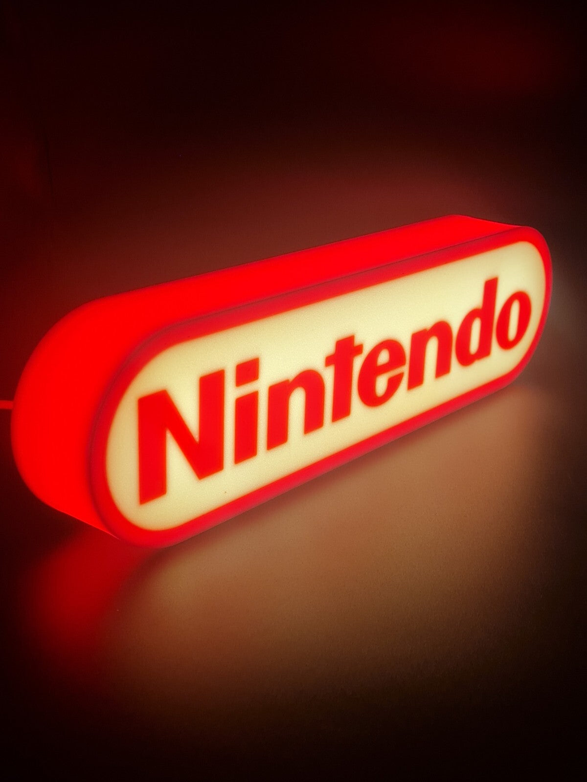 Nintendo LED light sign with illuminated logo viewed from side view