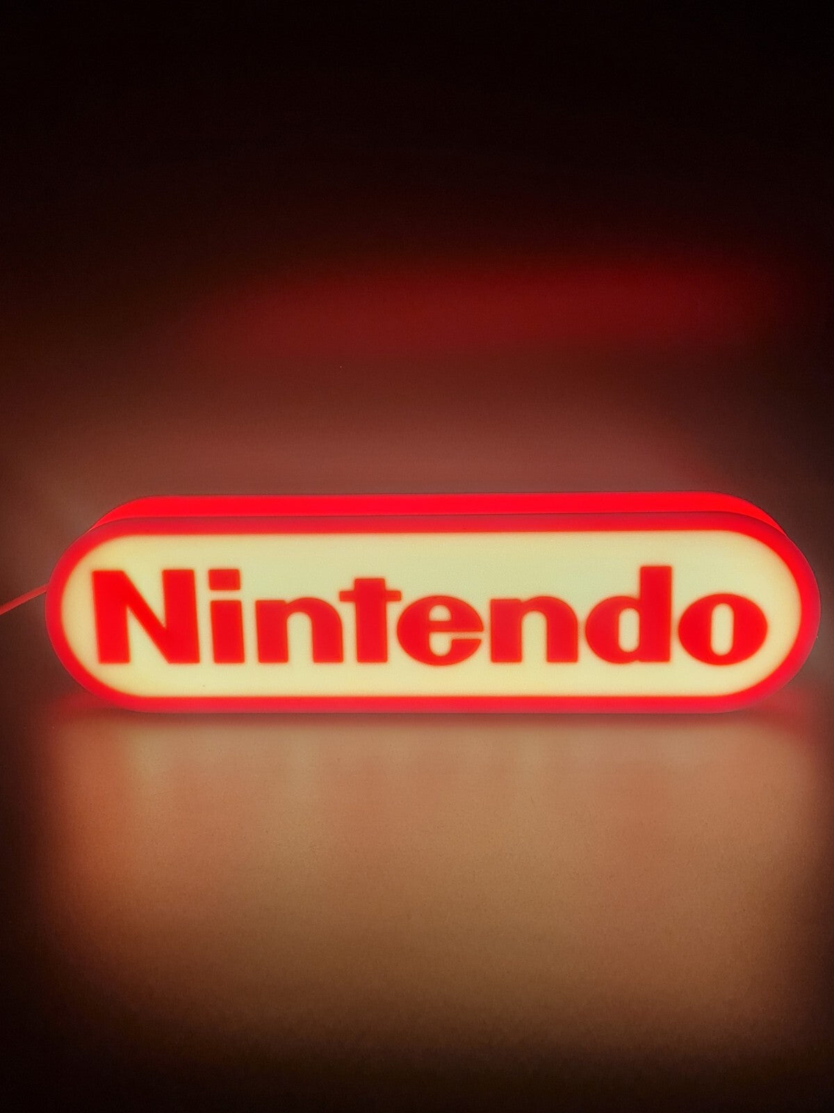 Nintendo LED light sign with illuminated logo viewed from straight on