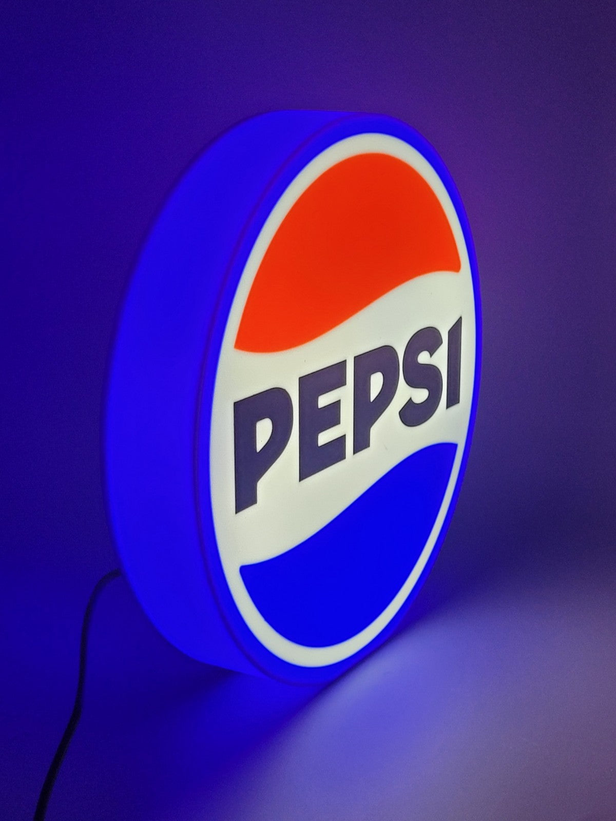 pepsi LED light sign with illuminated logo viewed from side view