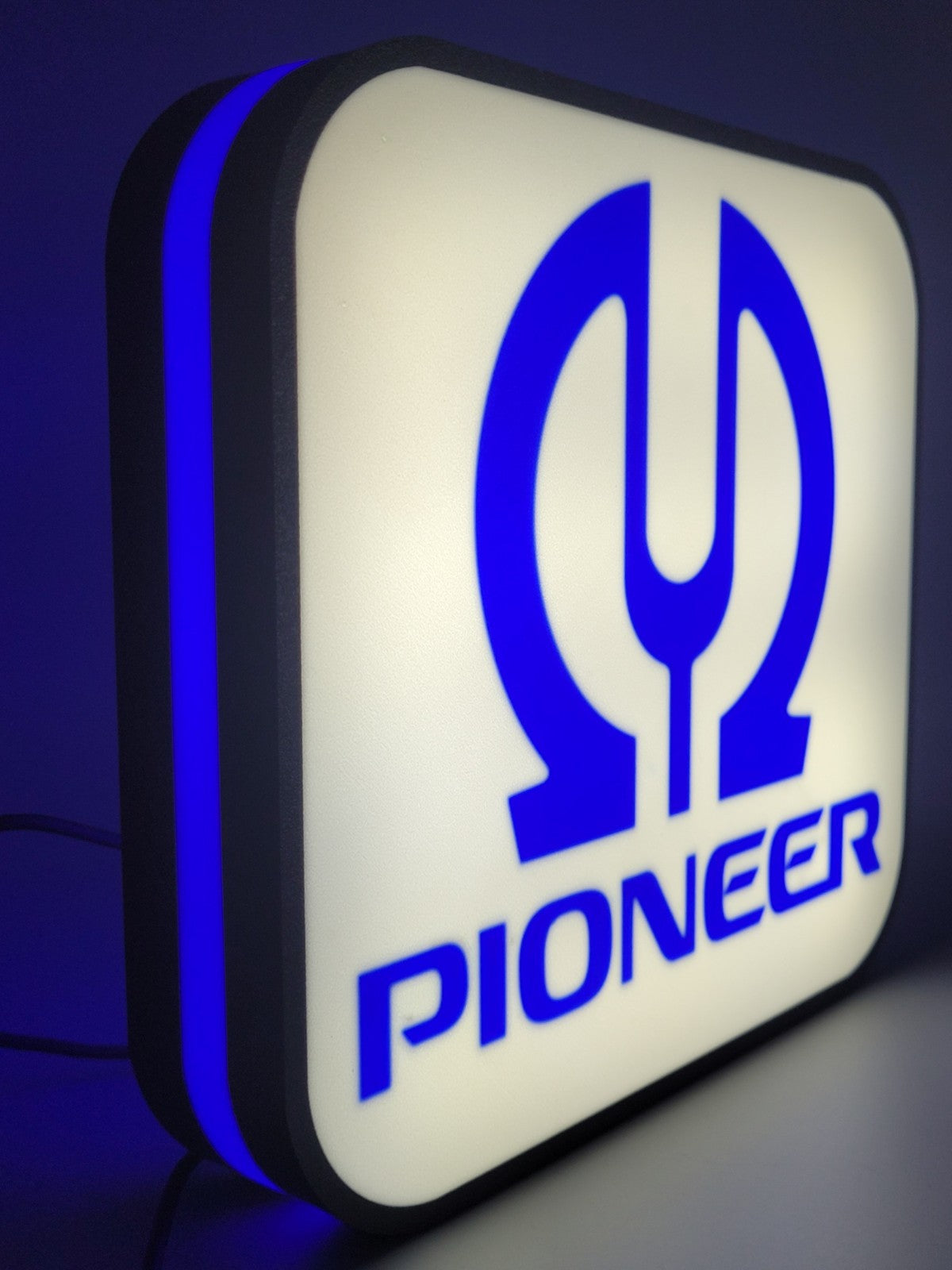 Pioneer LED light sign with illuminated logo viewed from straight on