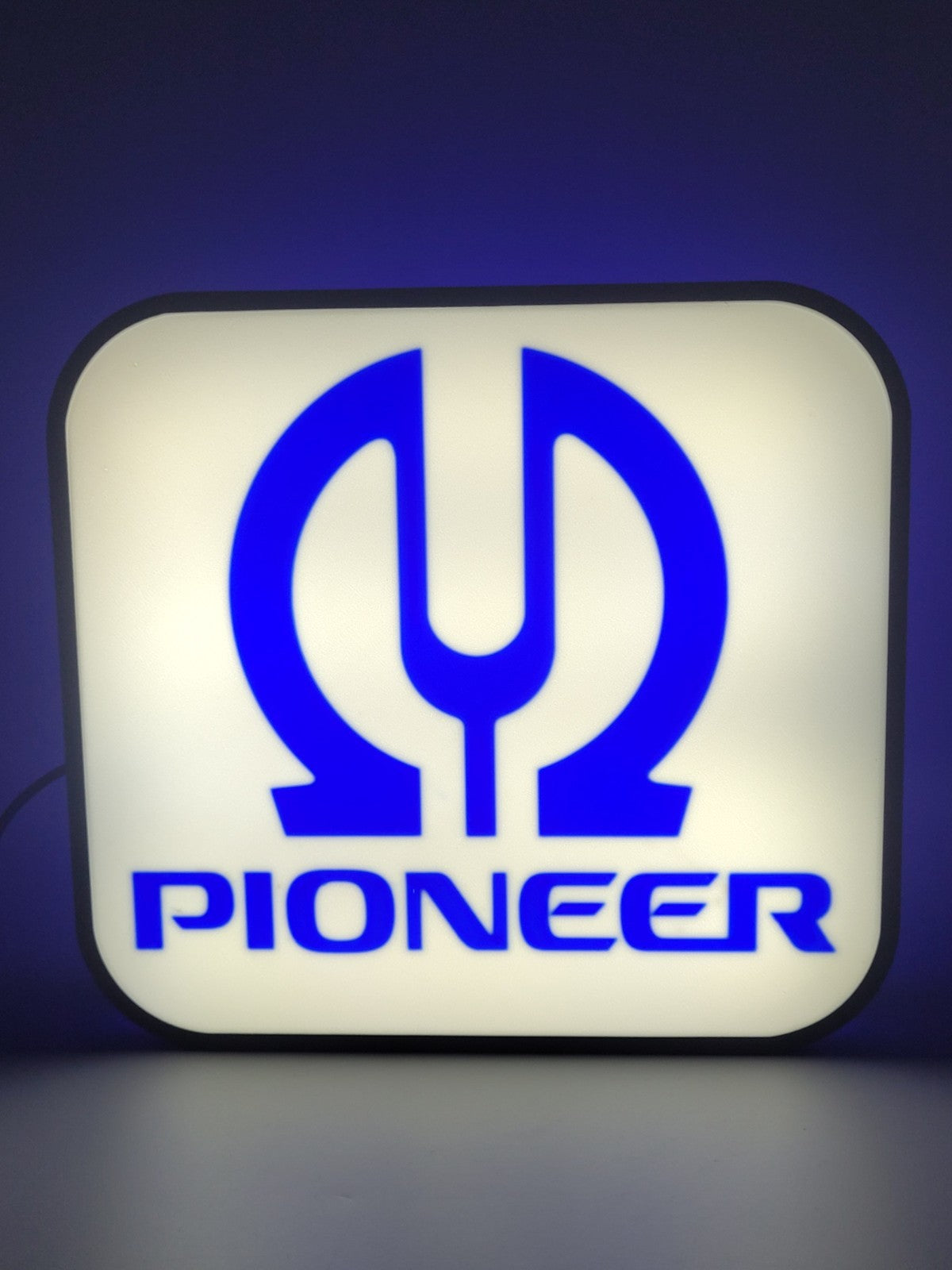 Pioneer LED light sign with illuminated logo viewed from straight on