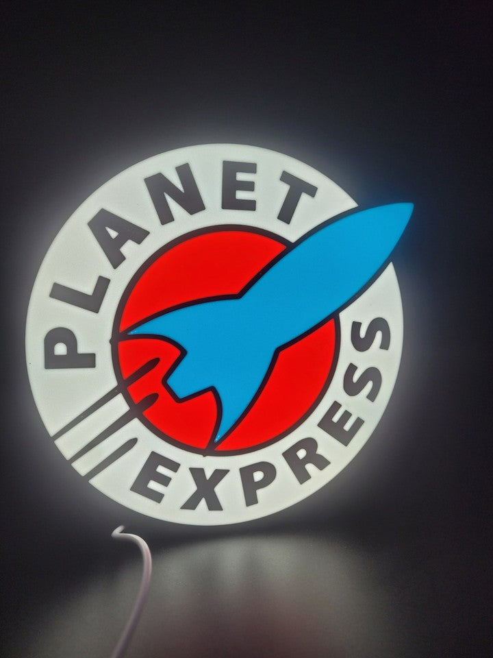 Planet Express LED light sign with illuminated logo viewed from straight on