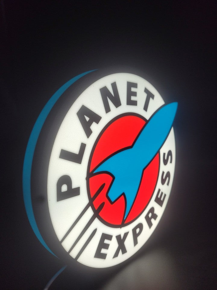 Planet Express LED light sign with illuminated logo viewed from side view