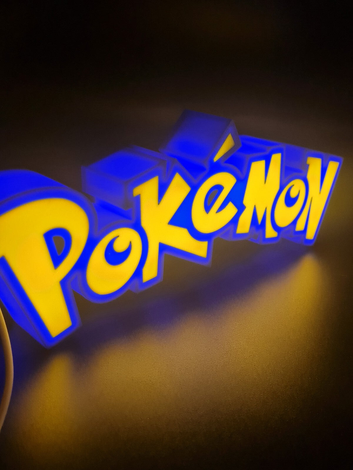 pokemon led light sign with illuminated logo viewed from side view