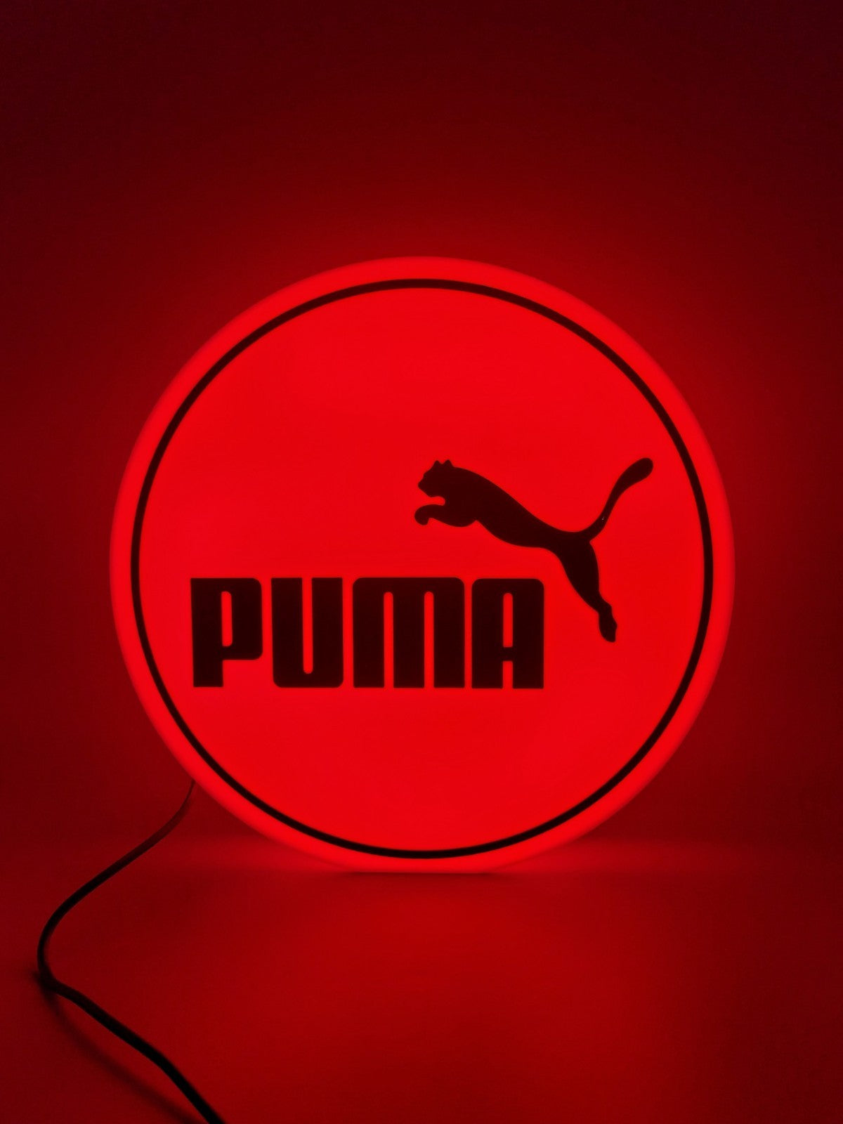 PUMA LED light sign with illuminated logo viewed from straight on