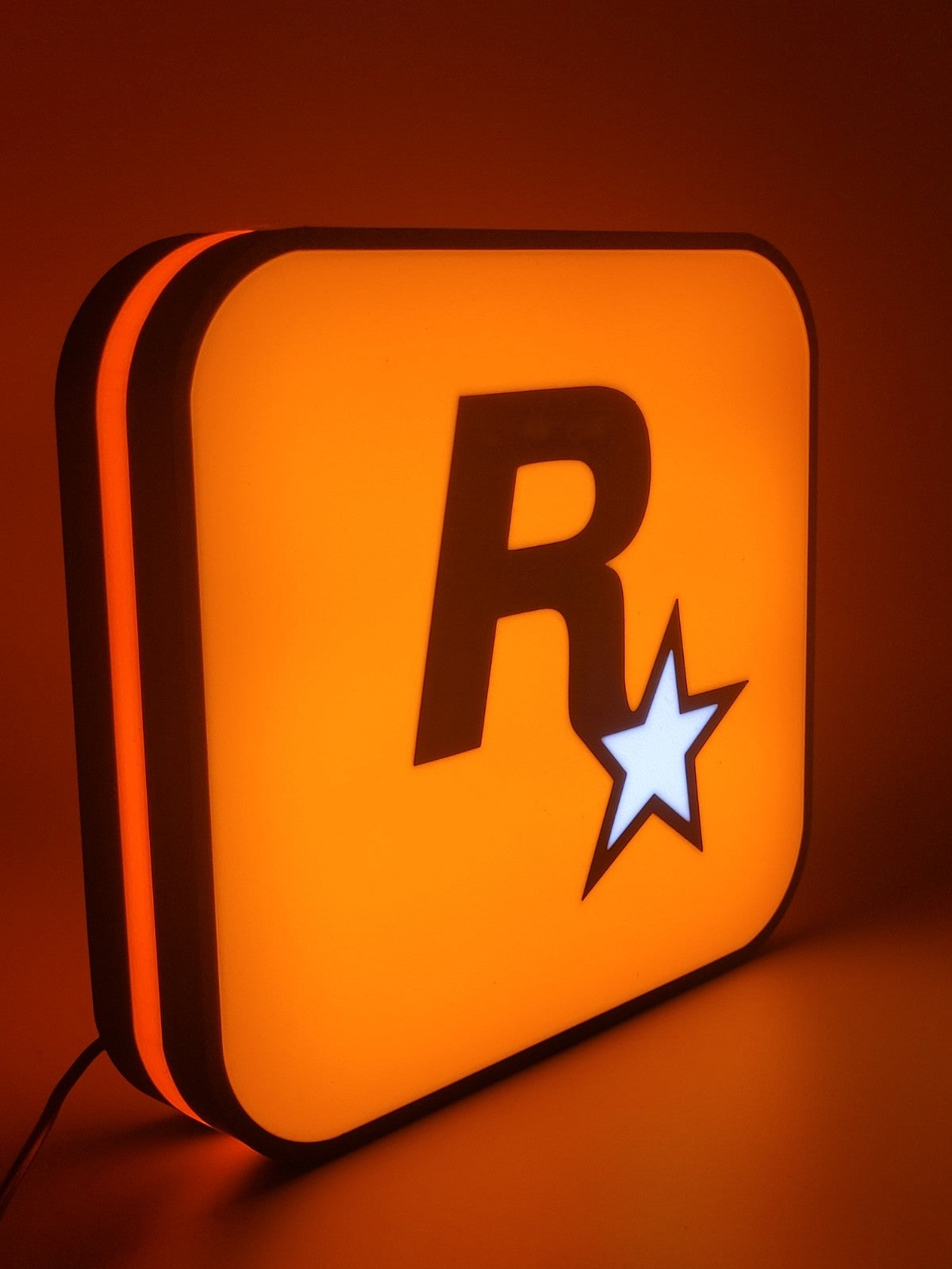 rockstar LED light sign with illuminated logo viewed from side view