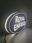 royal enfield led light sign with illuminated logo viewed from side view