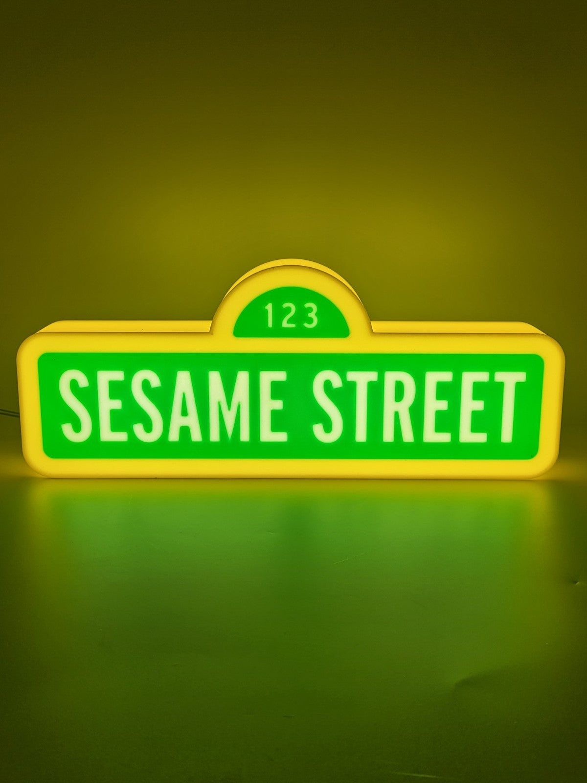 Sesame Street LED light sign with illuminated logo viewed from straight on