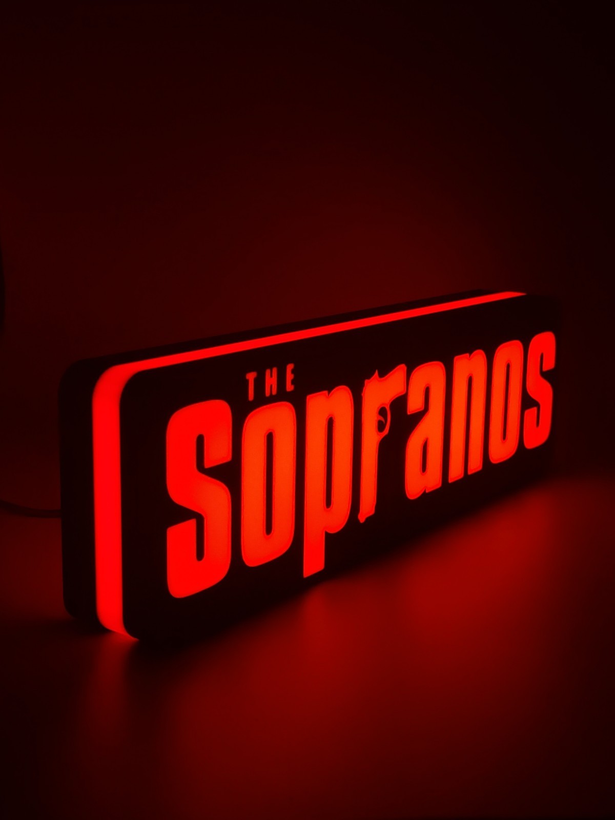 the sopranos LED light sign with illuminated logo viewed from side view