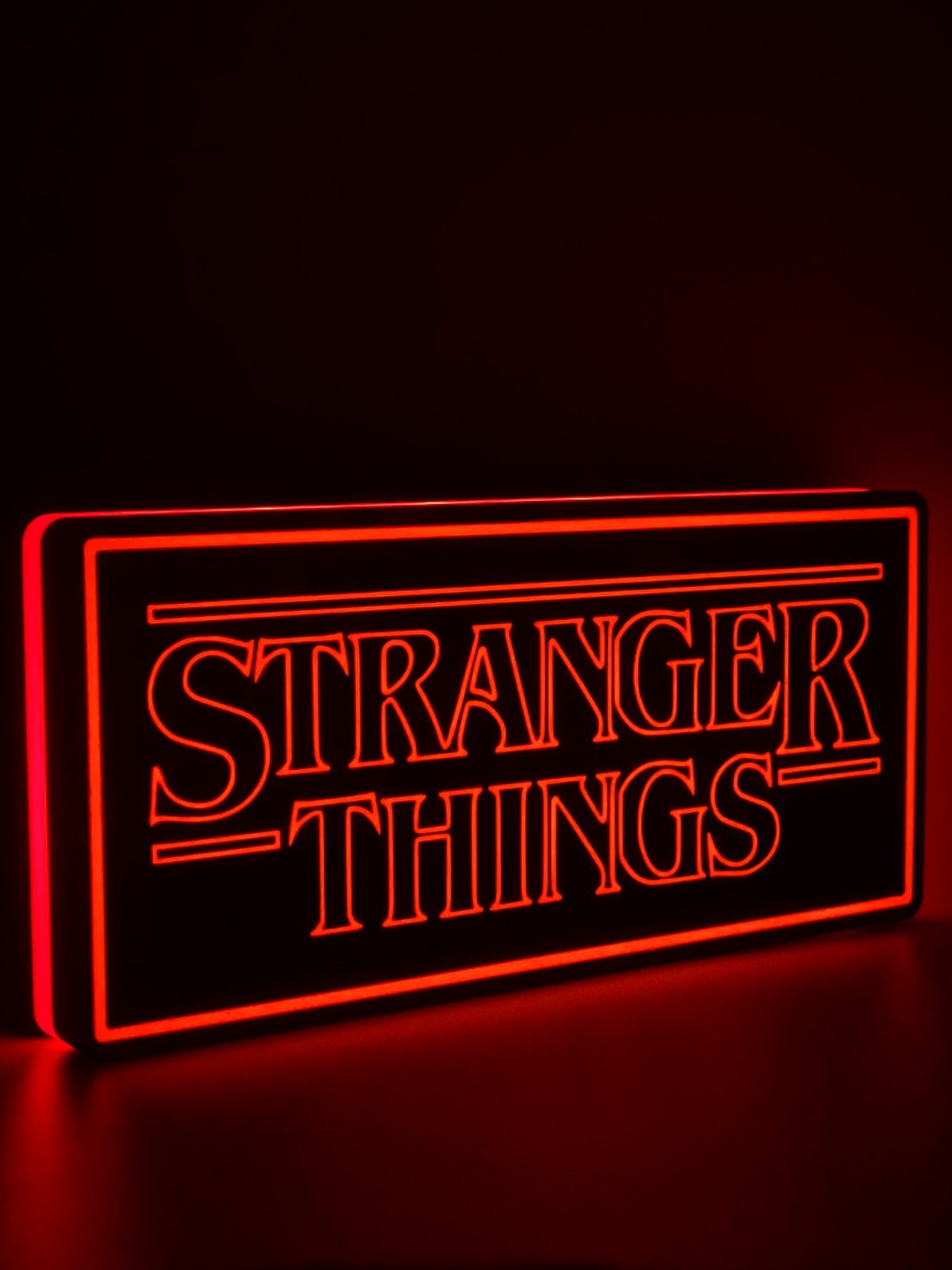 Stranger Things led light sign with illuminated logo viewed from side view 