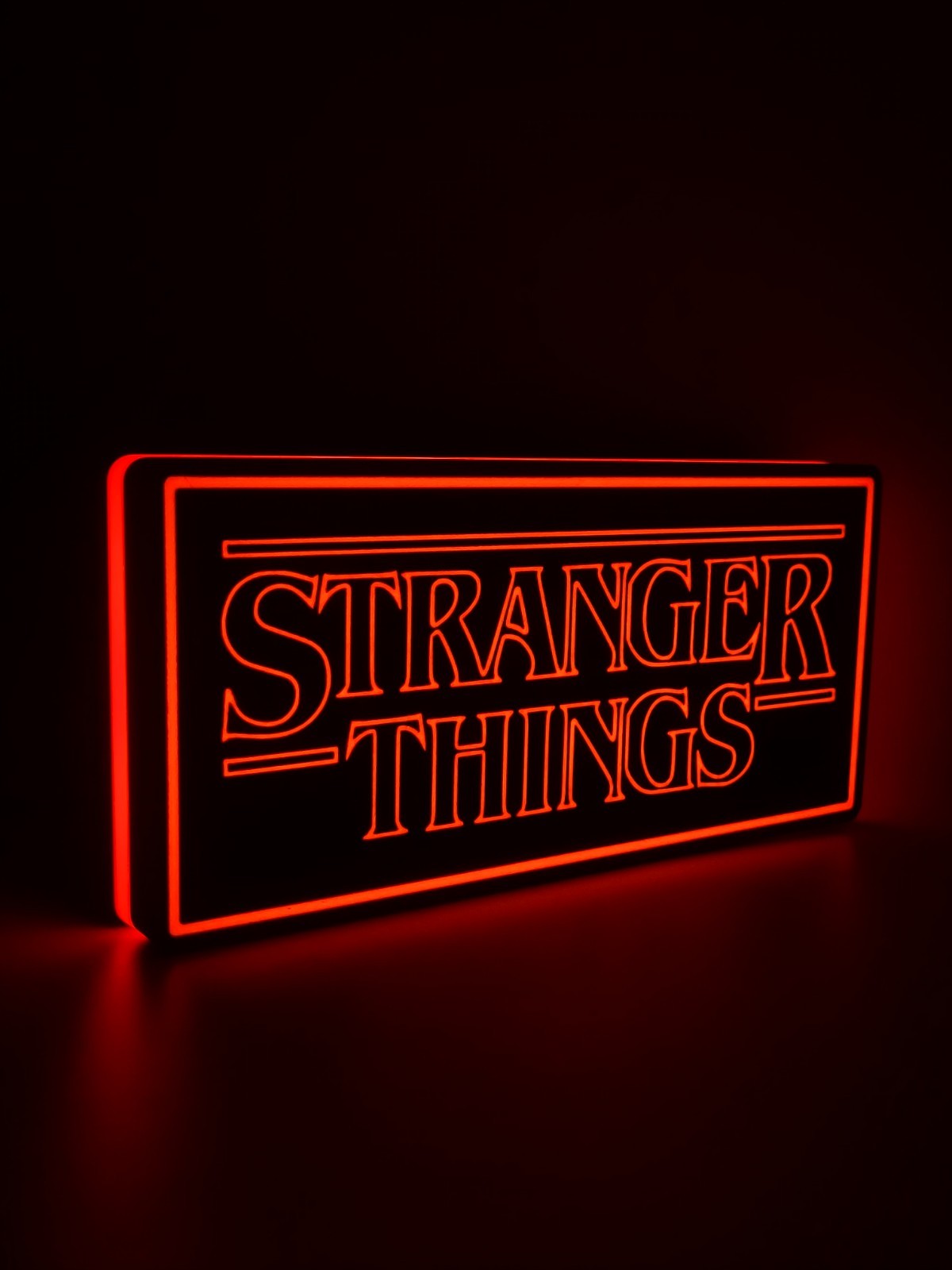 Stranger Things led light sign with illuminated logo viewed from side view