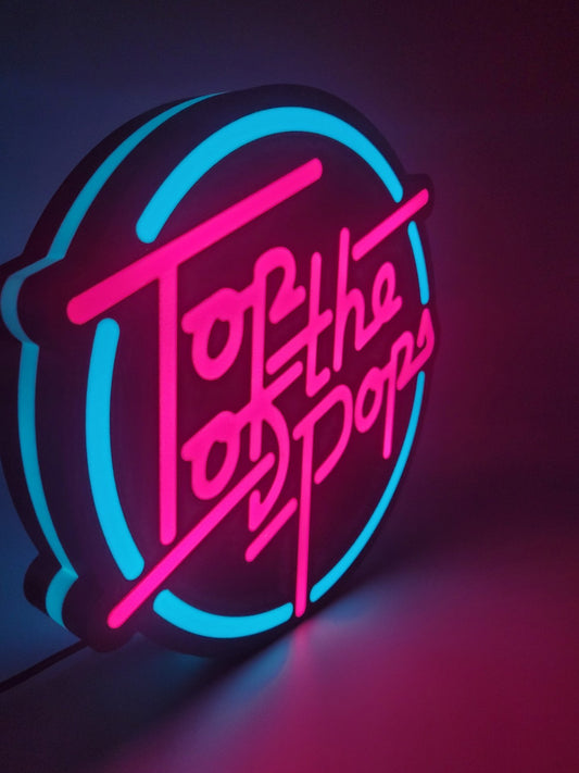 Top Of The Pop's LED light sign with illuminated logo viewed from side view