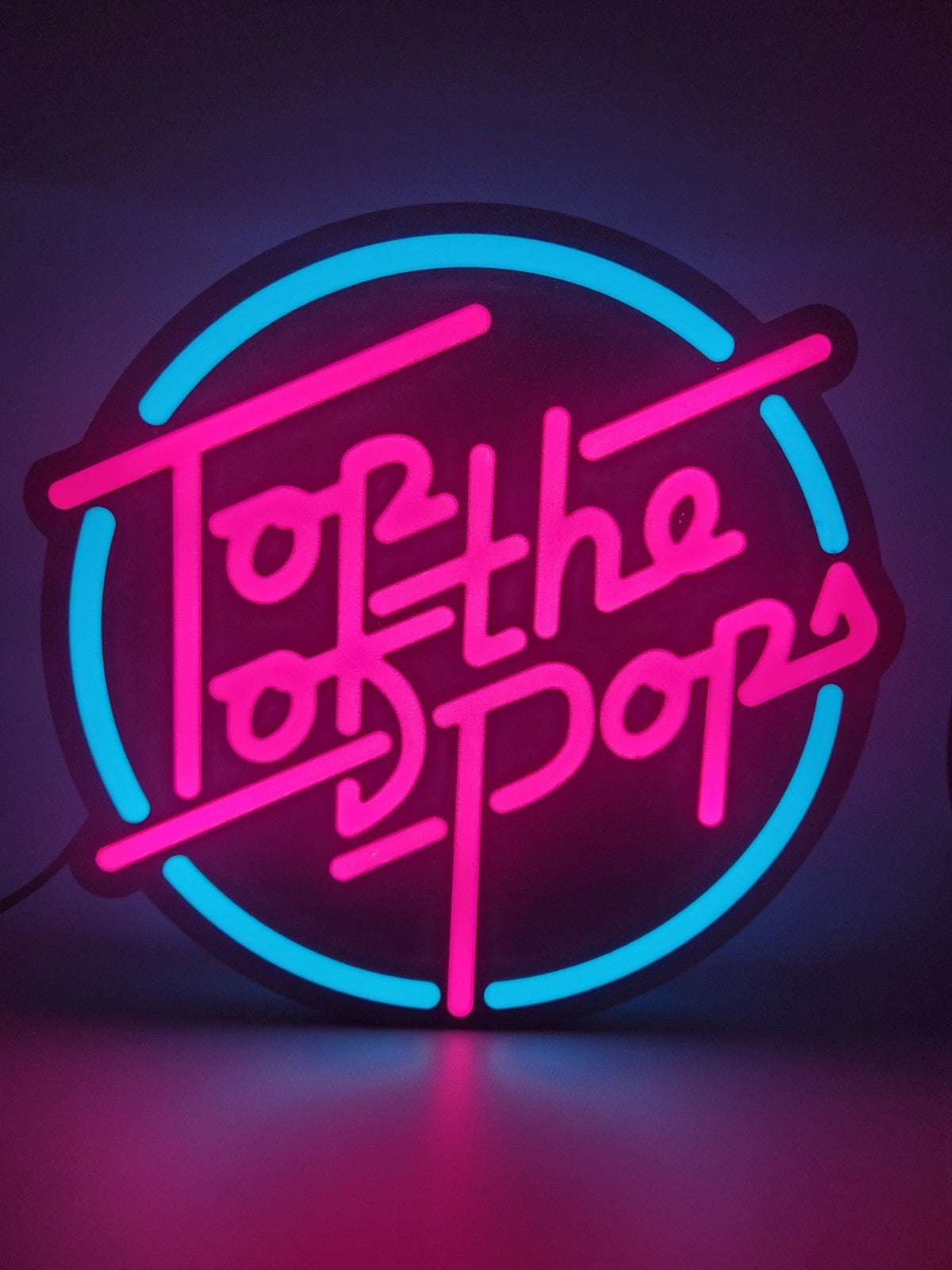 Top Of The Pop's LED light sign with illuminated logo viewed from straight on