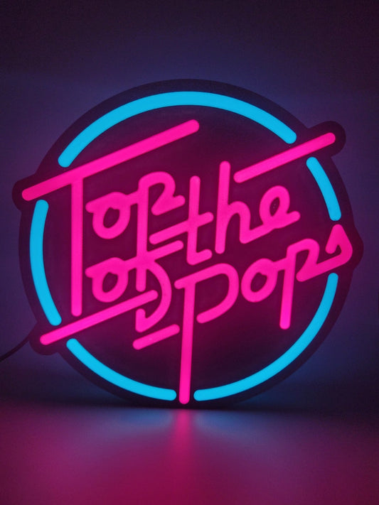 Top Of The Pop's LED light sign with illuminated logo viewed from straight on