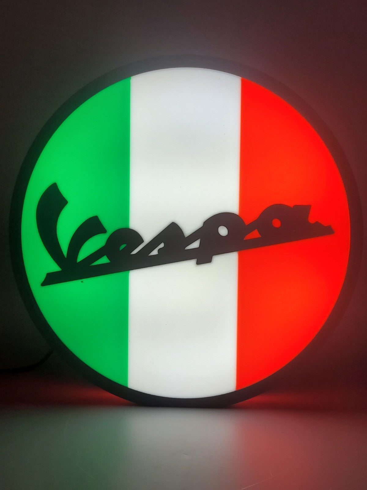 Vespa LED light sign with illuminated logo viewed from straight on
