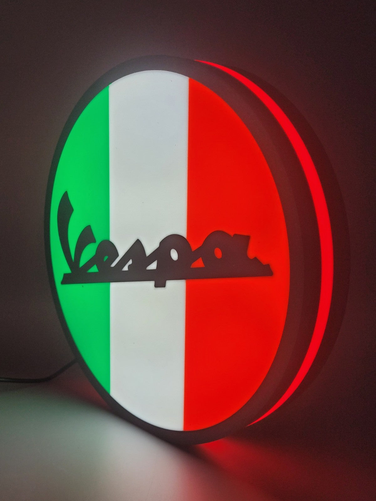 vespa led light sign with illuminated logo viewed from side view