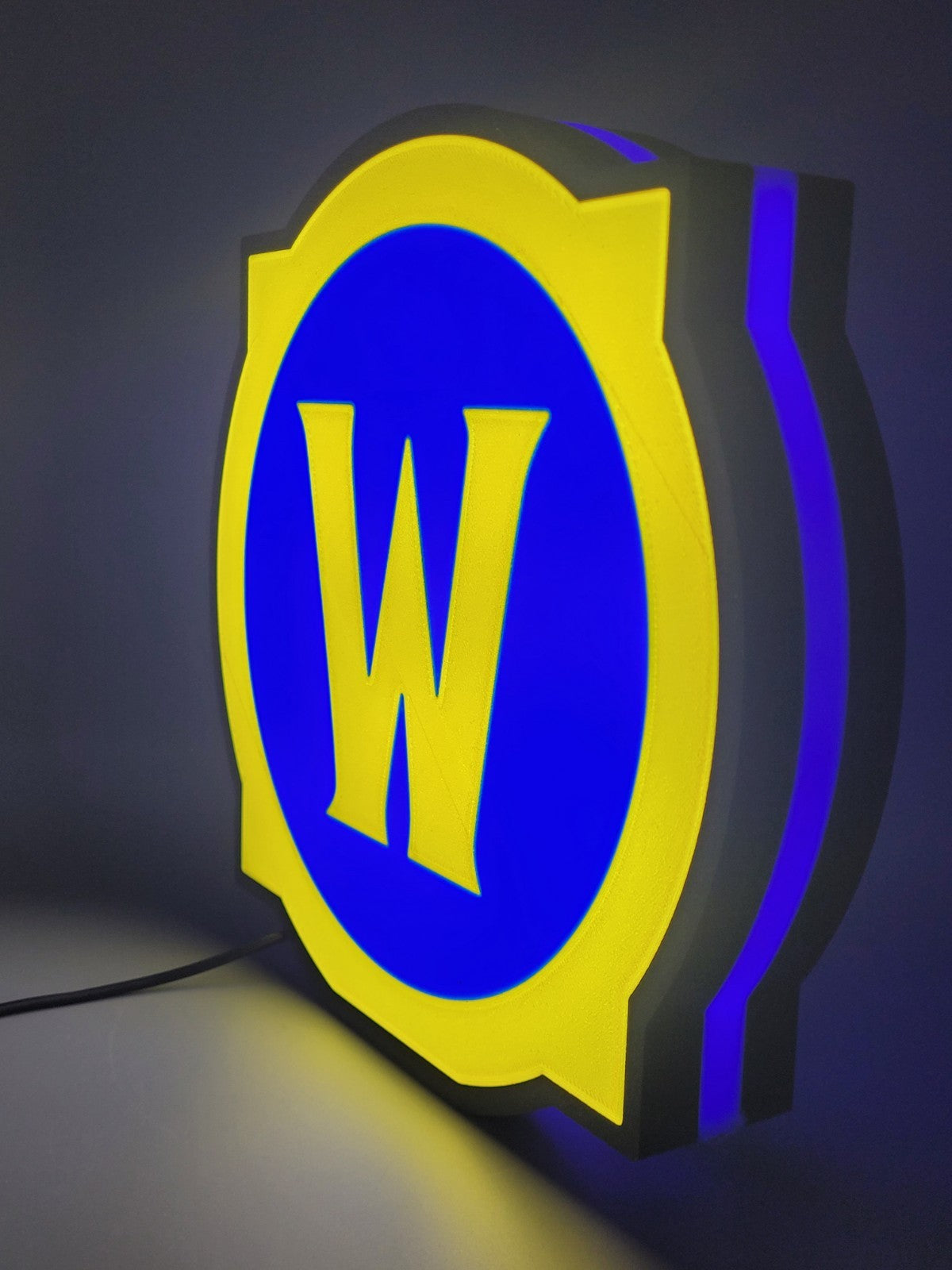 world of warcraft led light sign with illuminated logo viewed from side view