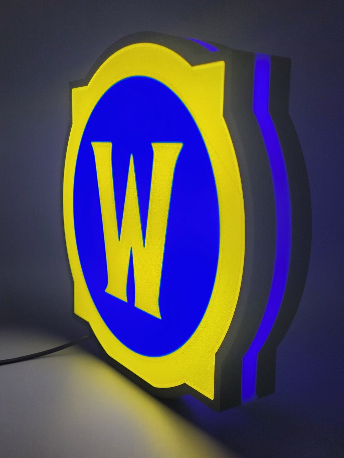 world of warcraft led light sign with illuminated logo viewed from side view