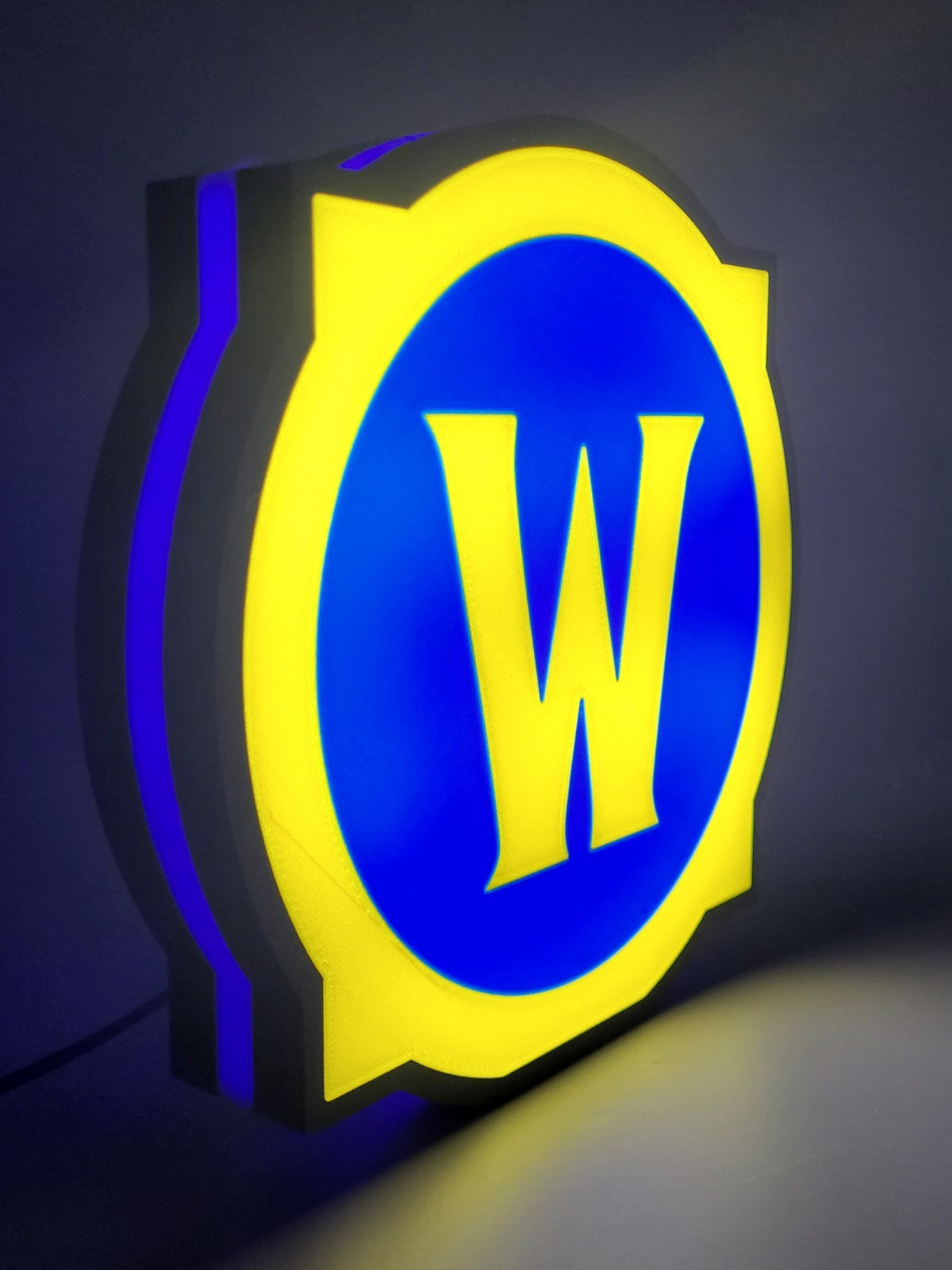 world of warcraft led light sign with illuminated logo viewed from side view