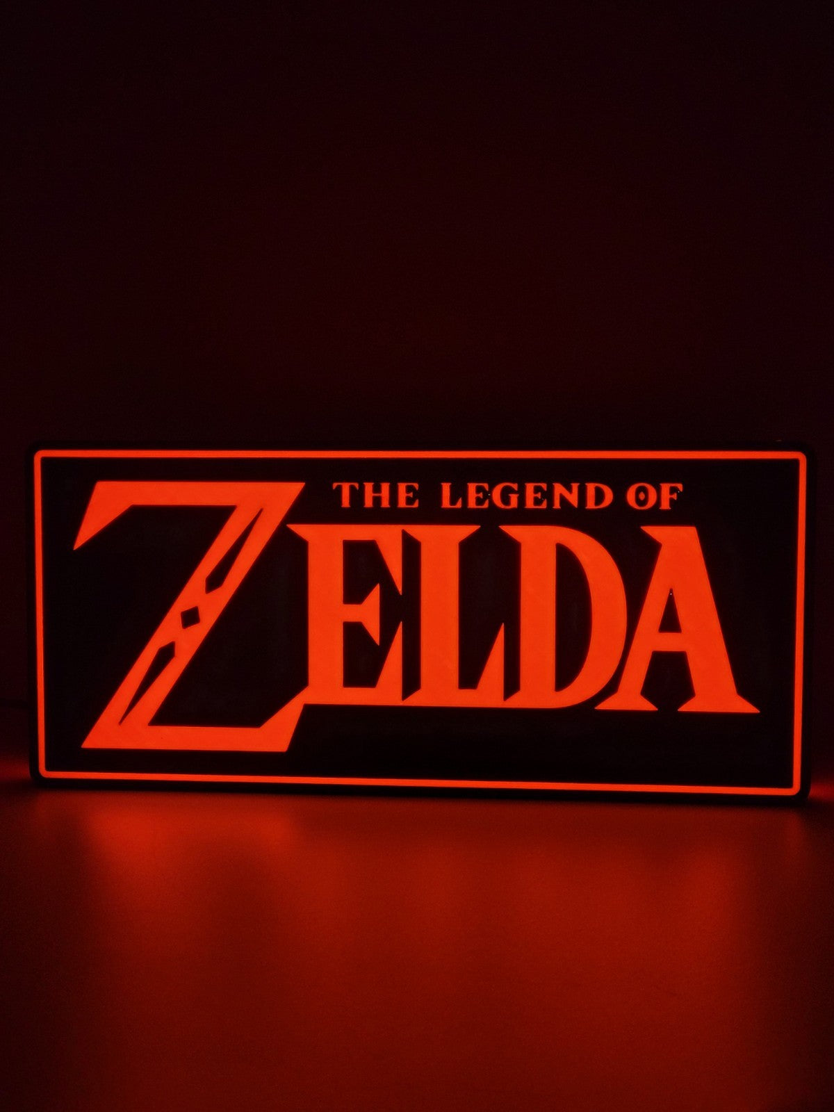 Zelda LED light sign with illuminated logo viewed from straight on
