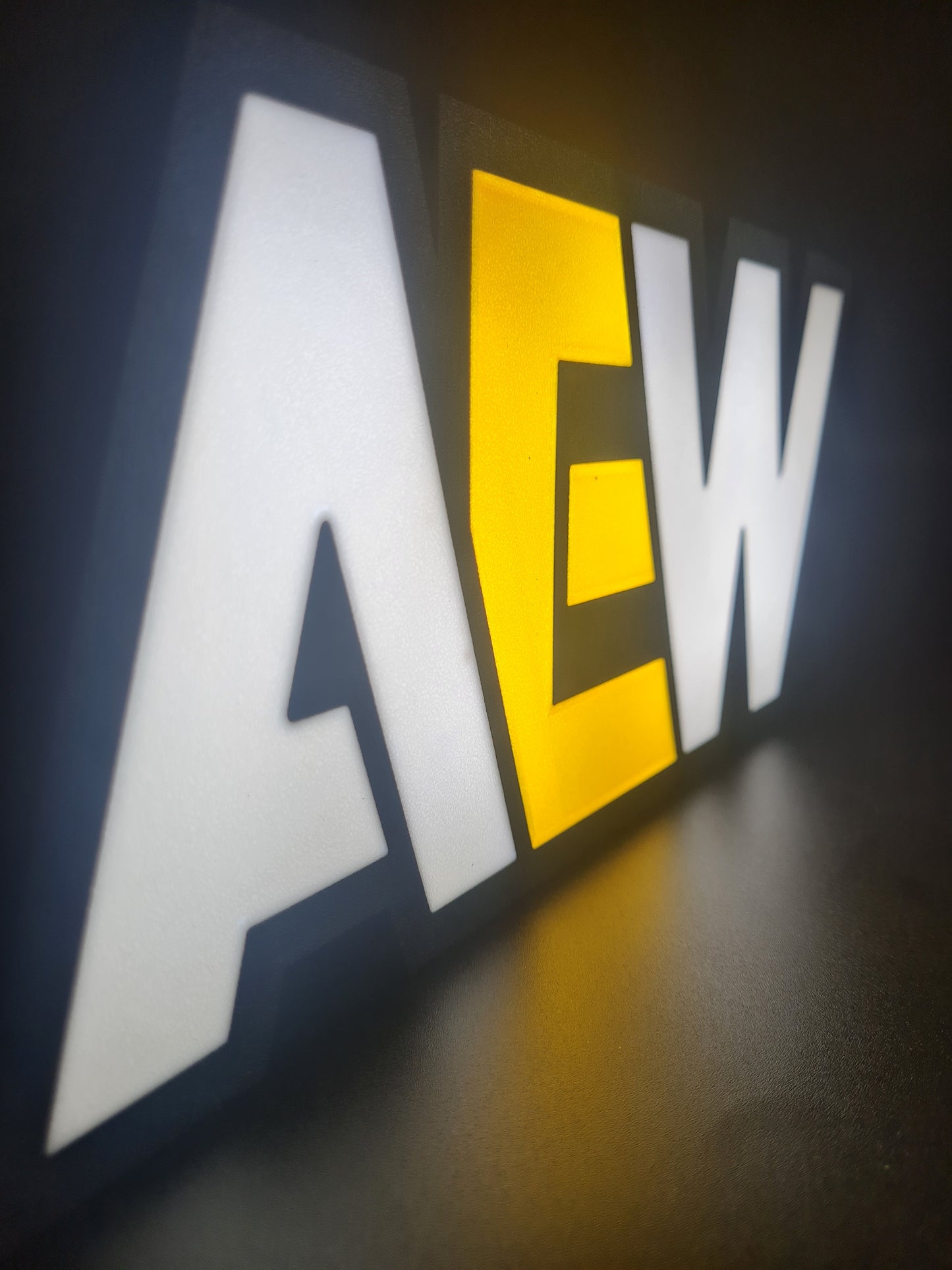 aew led light sign with illuminated logo viewed from side view