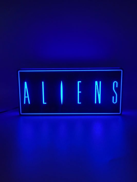 Aliens led light sign with illuminated logo viewed from straight on