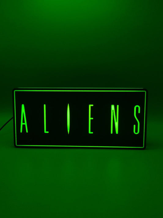 Aliens led light sign with illuminated logo viewed from straight on