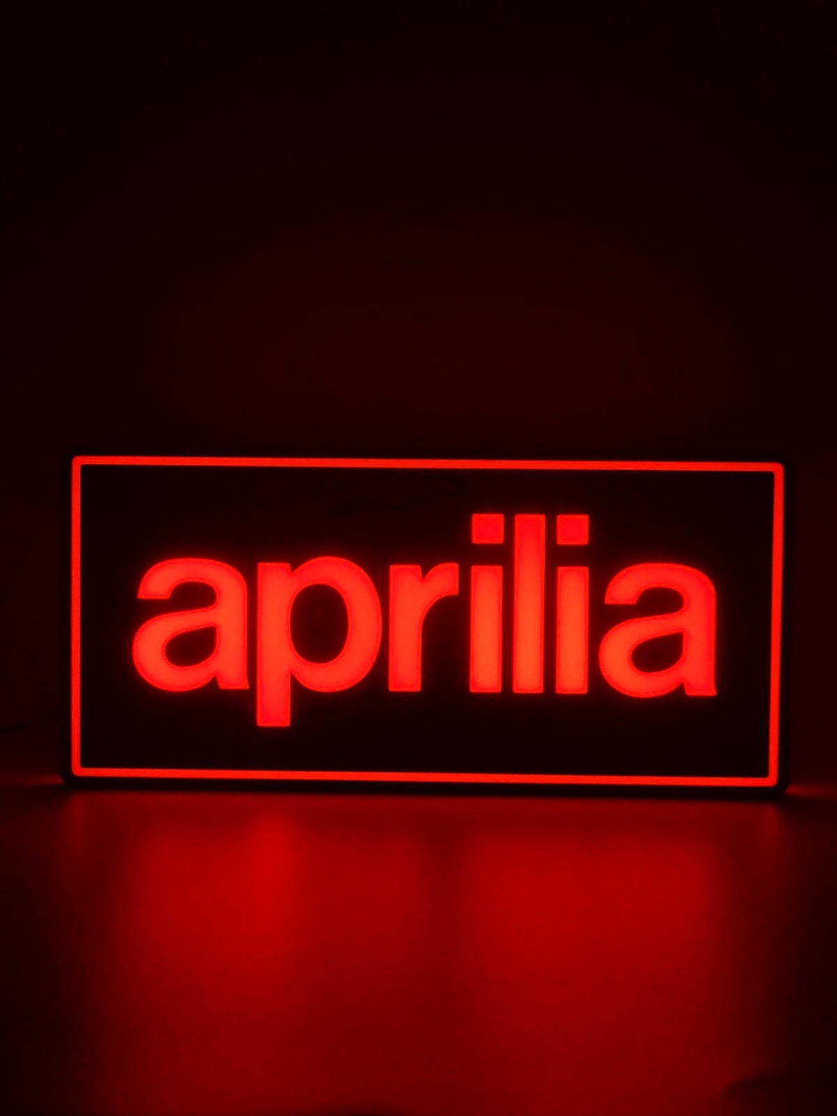 Aprilia led light sign with illuminated logo viewed from straight on