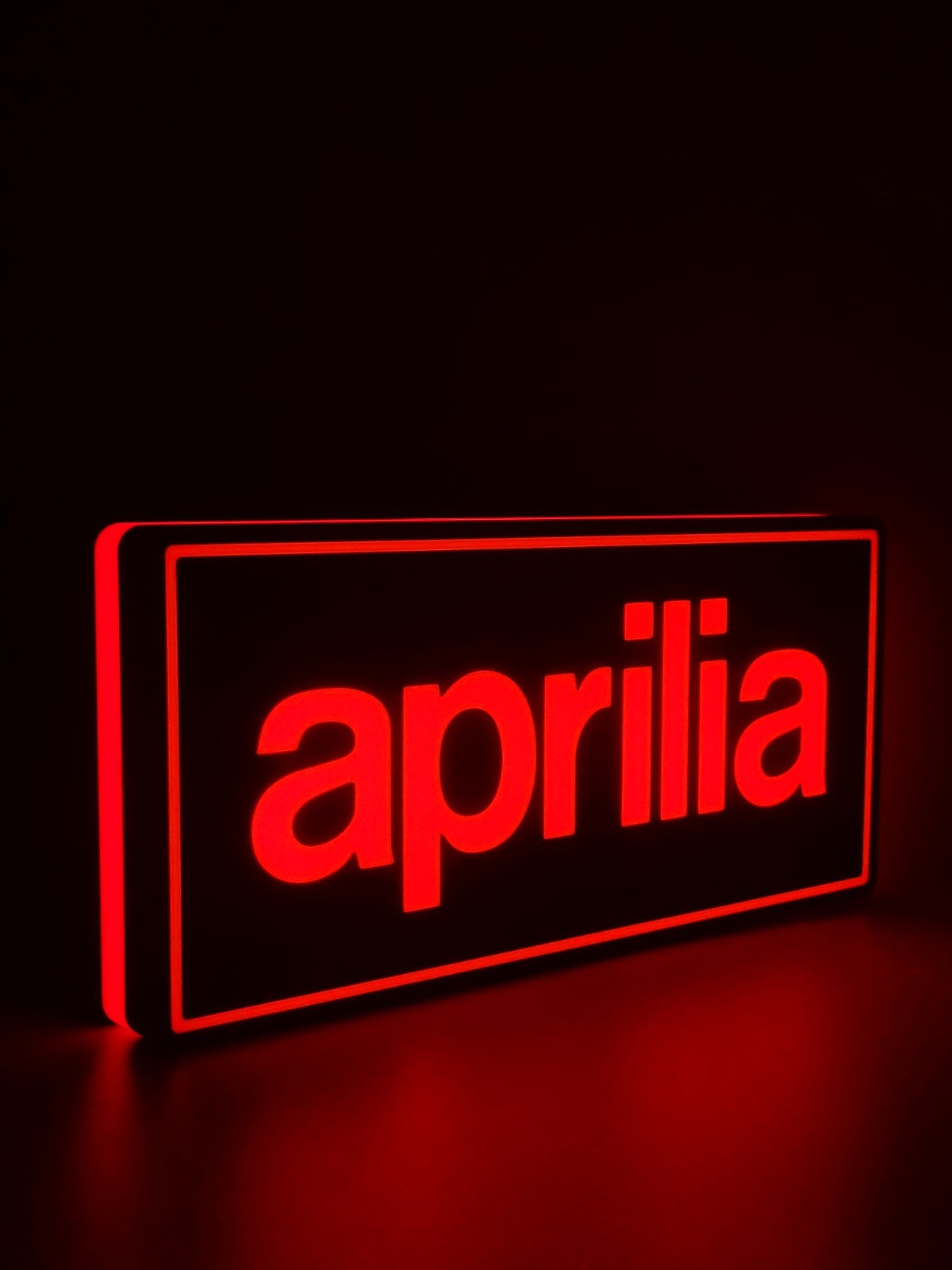 Aprilia led light sign with illuminated logo viewed from side view