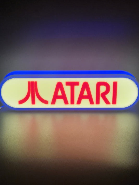 Atari LED light sign with illuminated logo viewed from straight on
