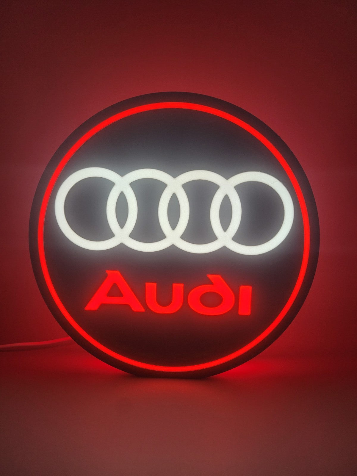 Audi led light sign with illuminated logo viewed from straight on