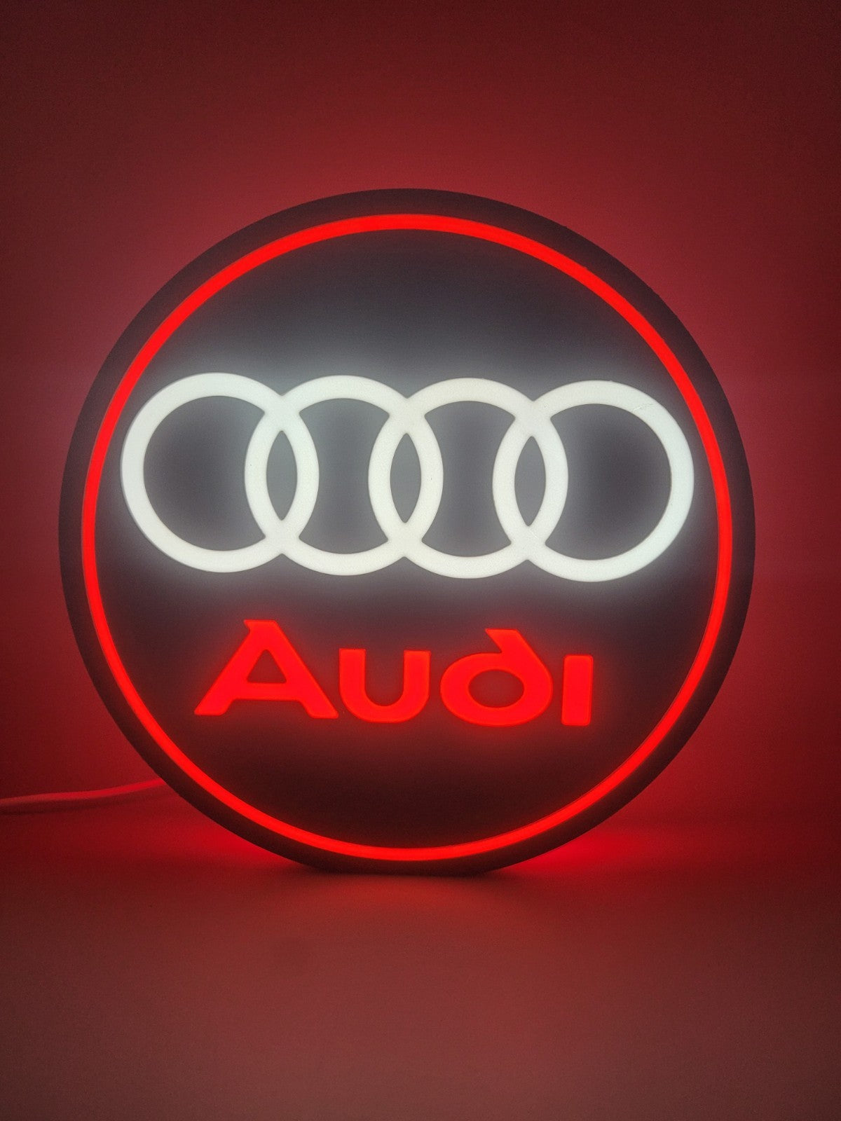 Audi led light sign with illuminated logo viewed from straight on