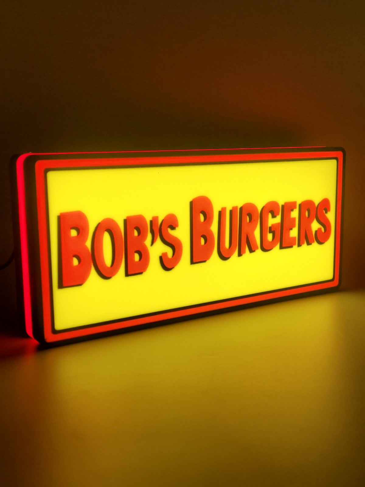 bob's burgers led light sign with illuminated logo viewed from side view
