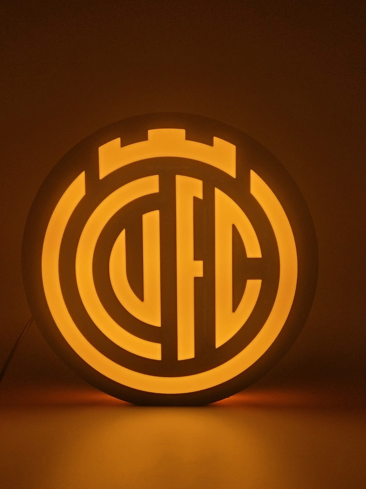 Cambridge FC led light sign with illuminated logo viewed from straight on