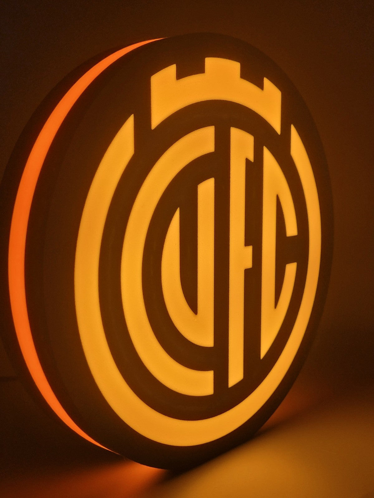 Cambridge FC led light sign with illuminated logo viewed from side view