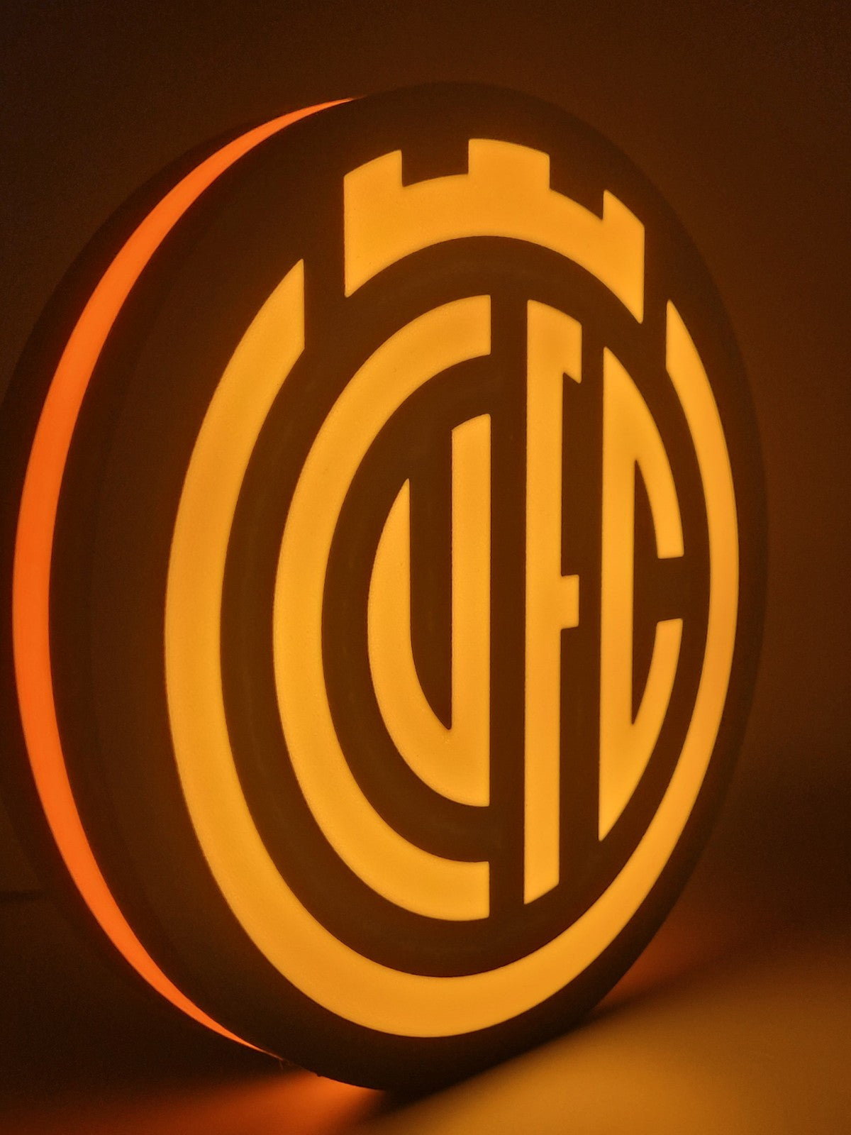 Cambridge FC led light sign with illuminated logo viewed from side view