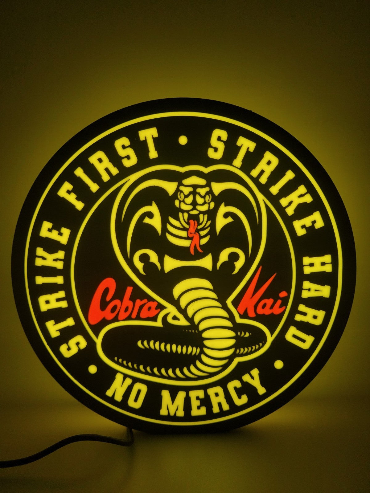 Cobra Kai led light sign with illuminated logo viewed from straight on