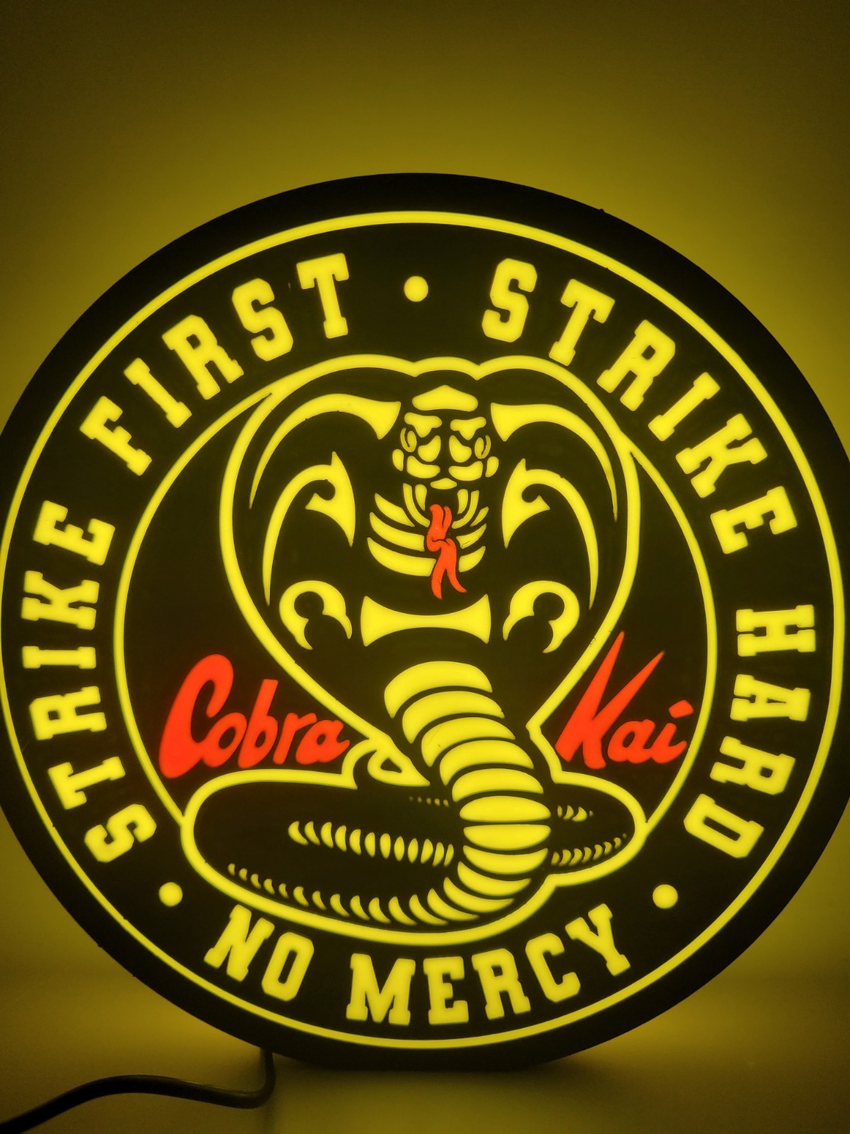 Cobra Kai led light sign with illuminated logo viewed from straight on