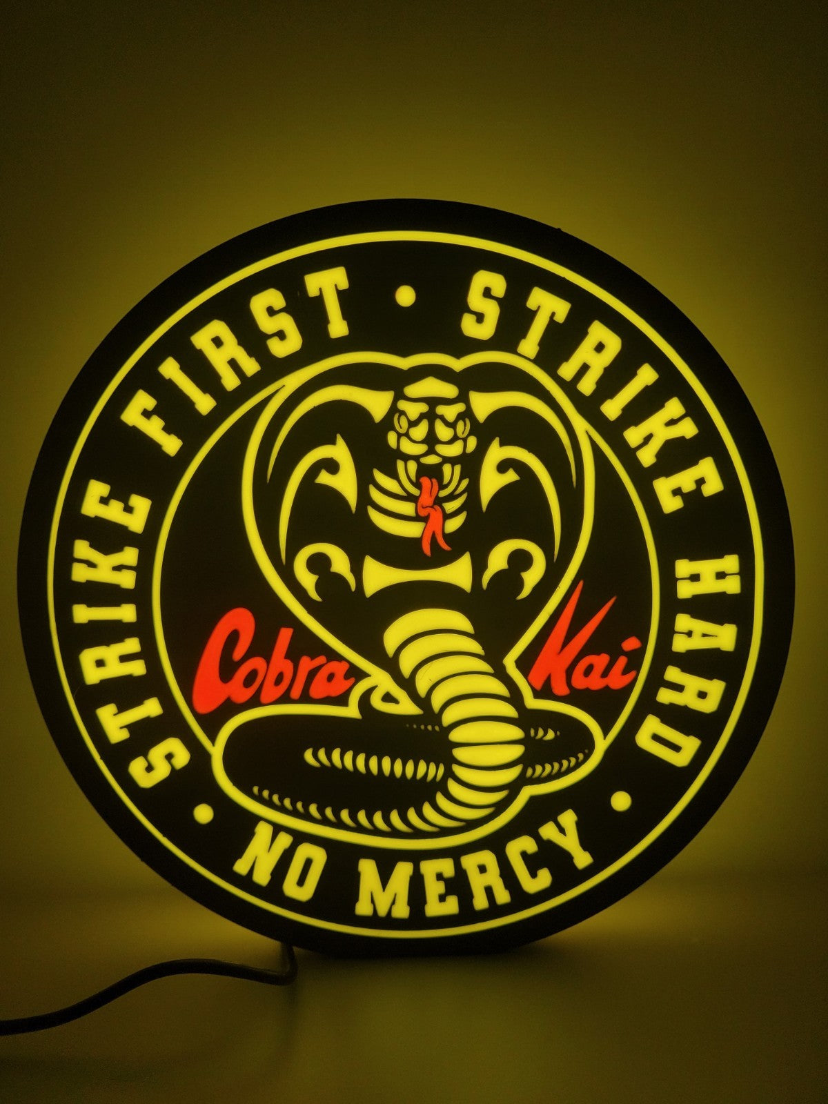 Cobra Kai led light sign with illuminated logo viewed from straight on