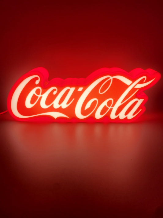 coca-cola led light sign with illuminated logo viewed from straight on
