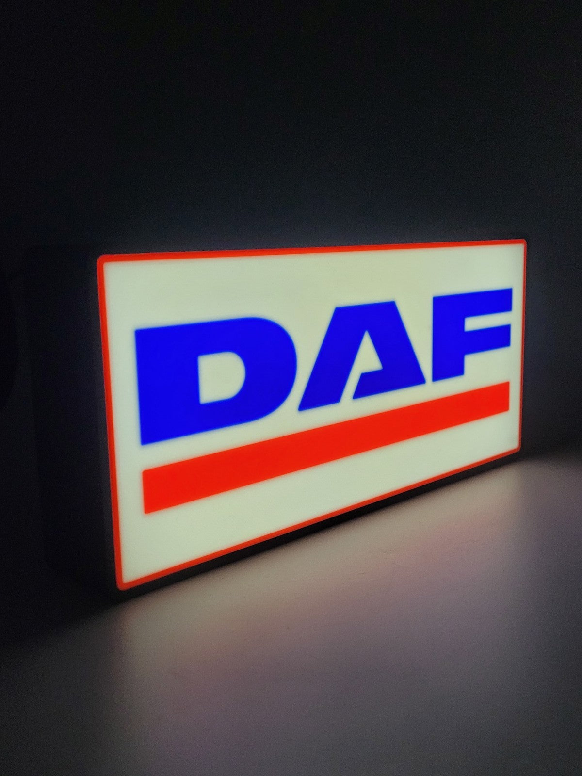 DAF led light sign with illuminated logo viewed from side view