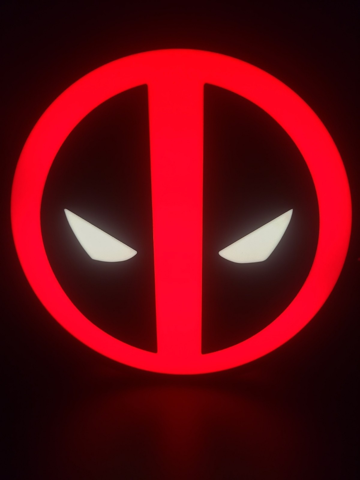 Deadpool LED light sign with illuminated logo viewed from straight on
