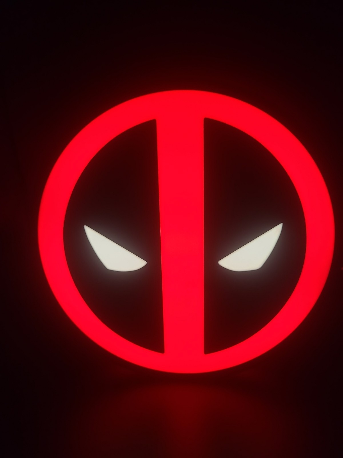 Deadpool LED light sign with illuminated logo viewed from straight on
