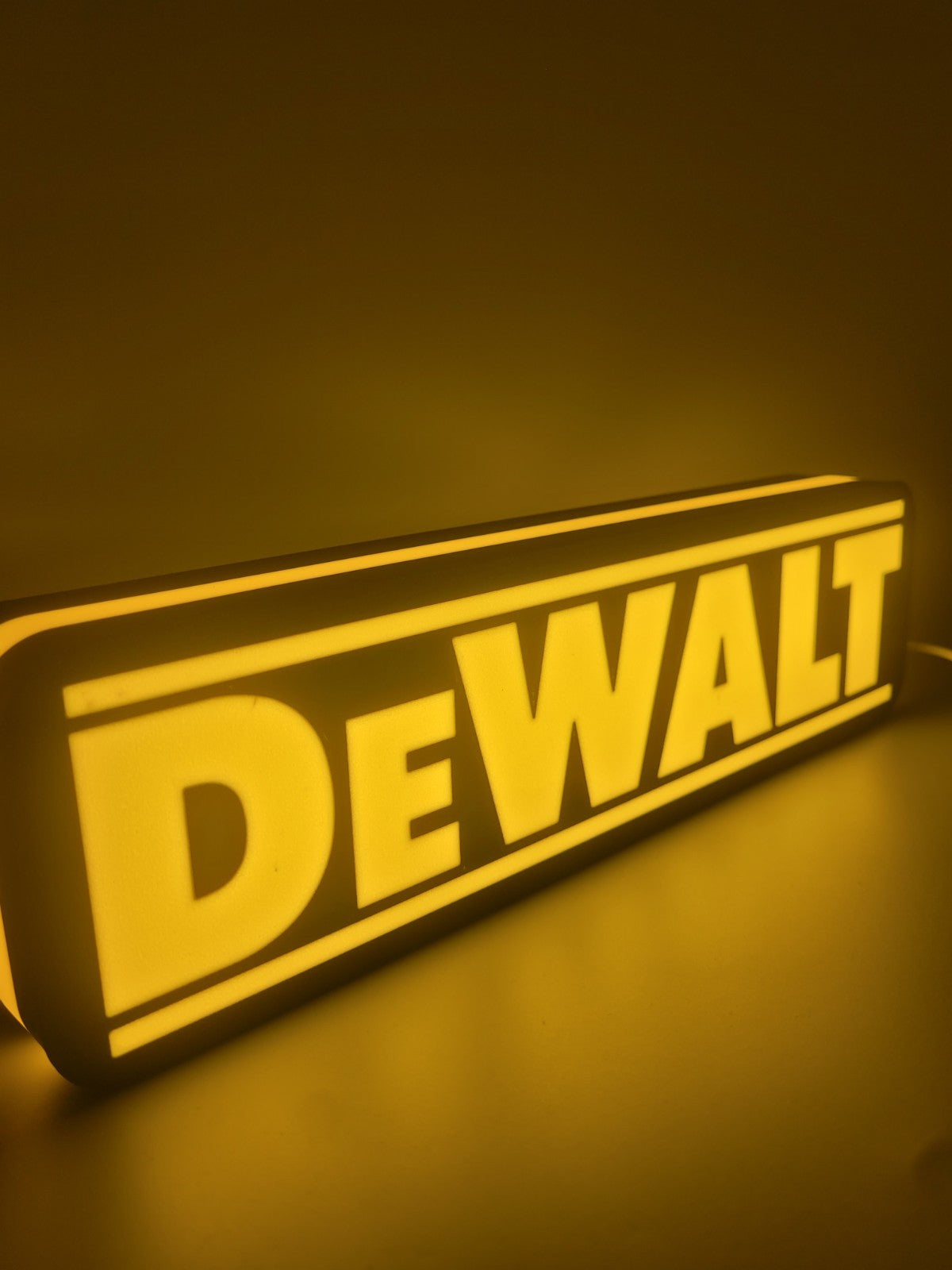 Dewalt LED light sign with illuminated logo viewed from side view