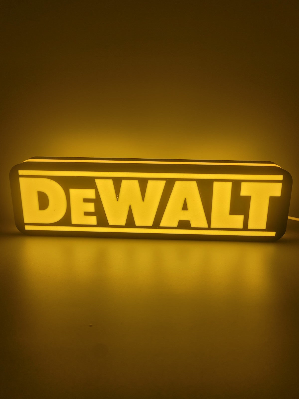 Dewalt LED light sign with illuminated logo viewed from straight on