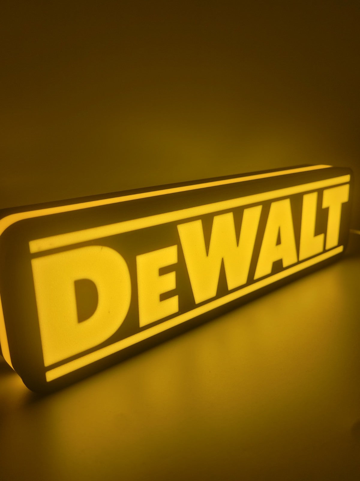Dewalt LED light sign with illuminated logo viewed from side view