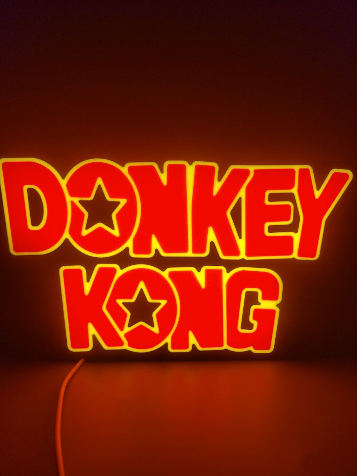 Donkey Kong led light sign with illuminated logo viewed from straight on