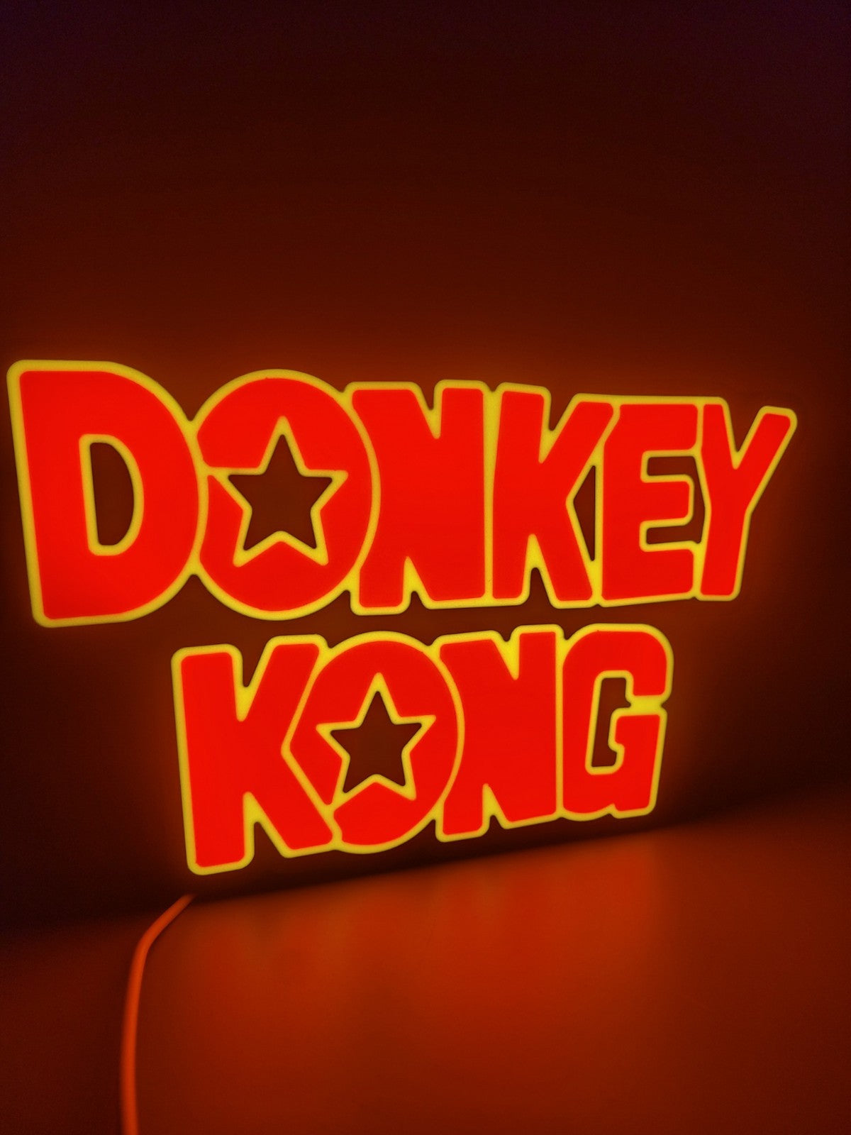 Donkey Kong led light sign with illuminated logo viewed from side view