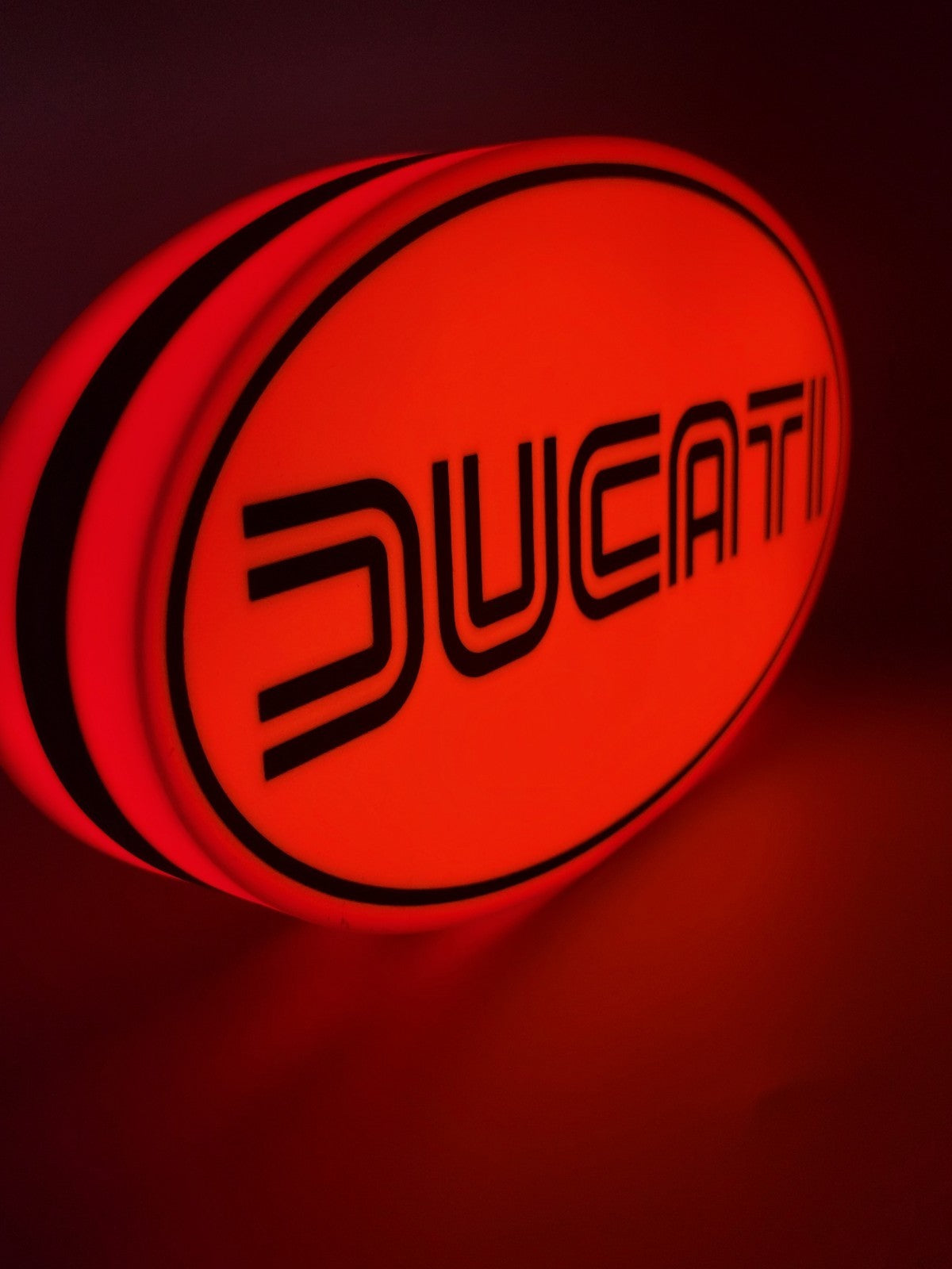 Ducati led light sign with illuminated logo viewed from side view