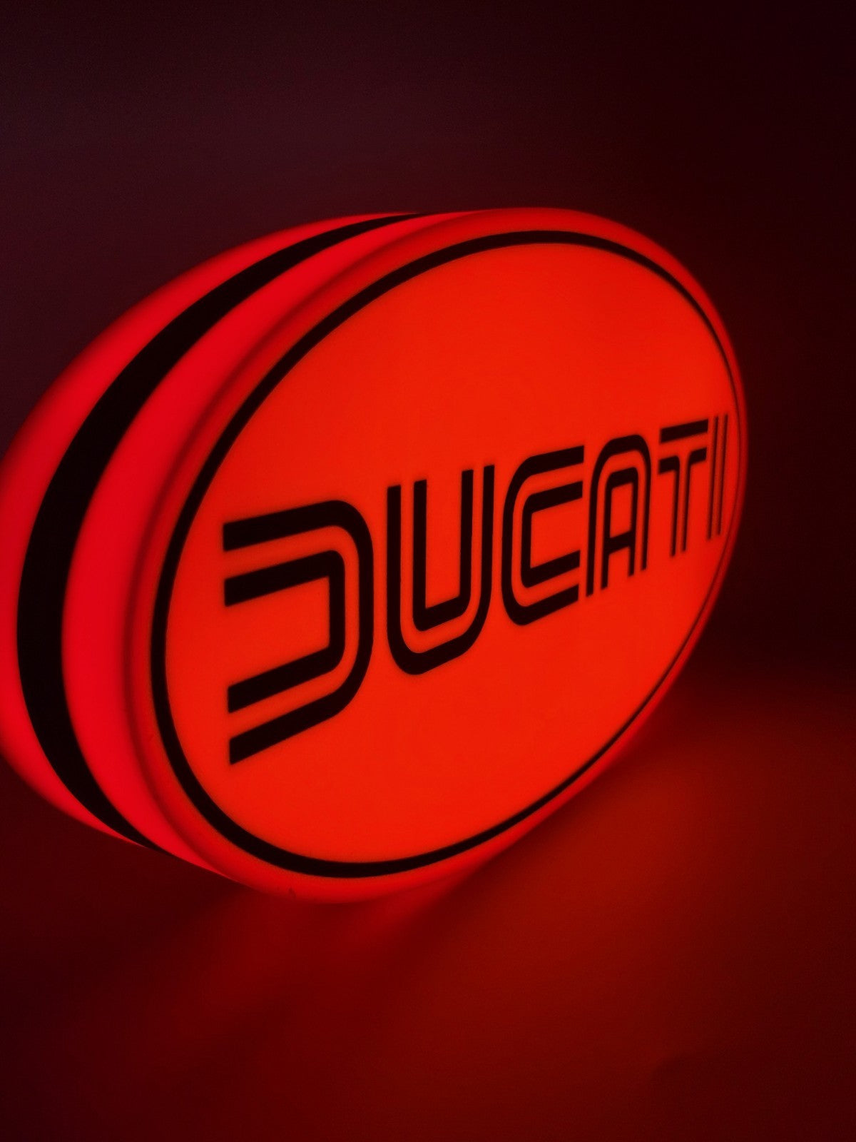 Ducati led light sign with illuminated logo viewed from side view